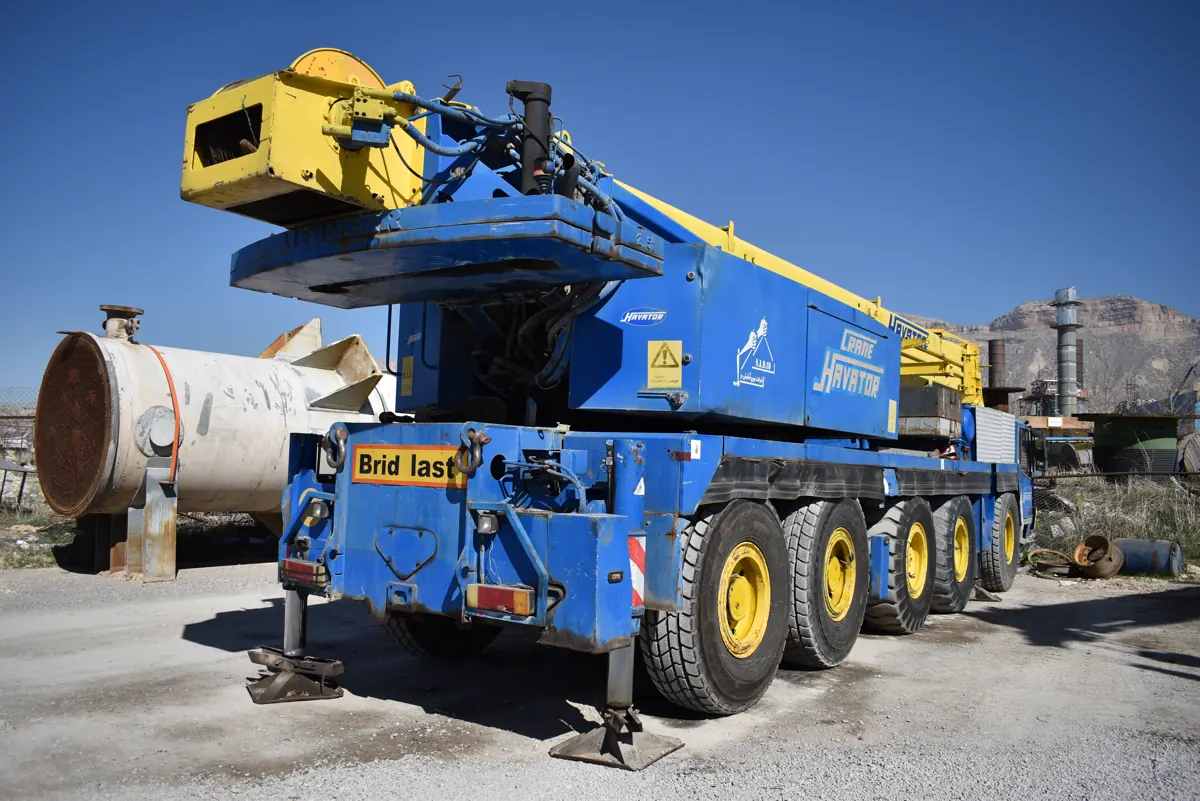 Mobile crane lifting equipment at a plant site