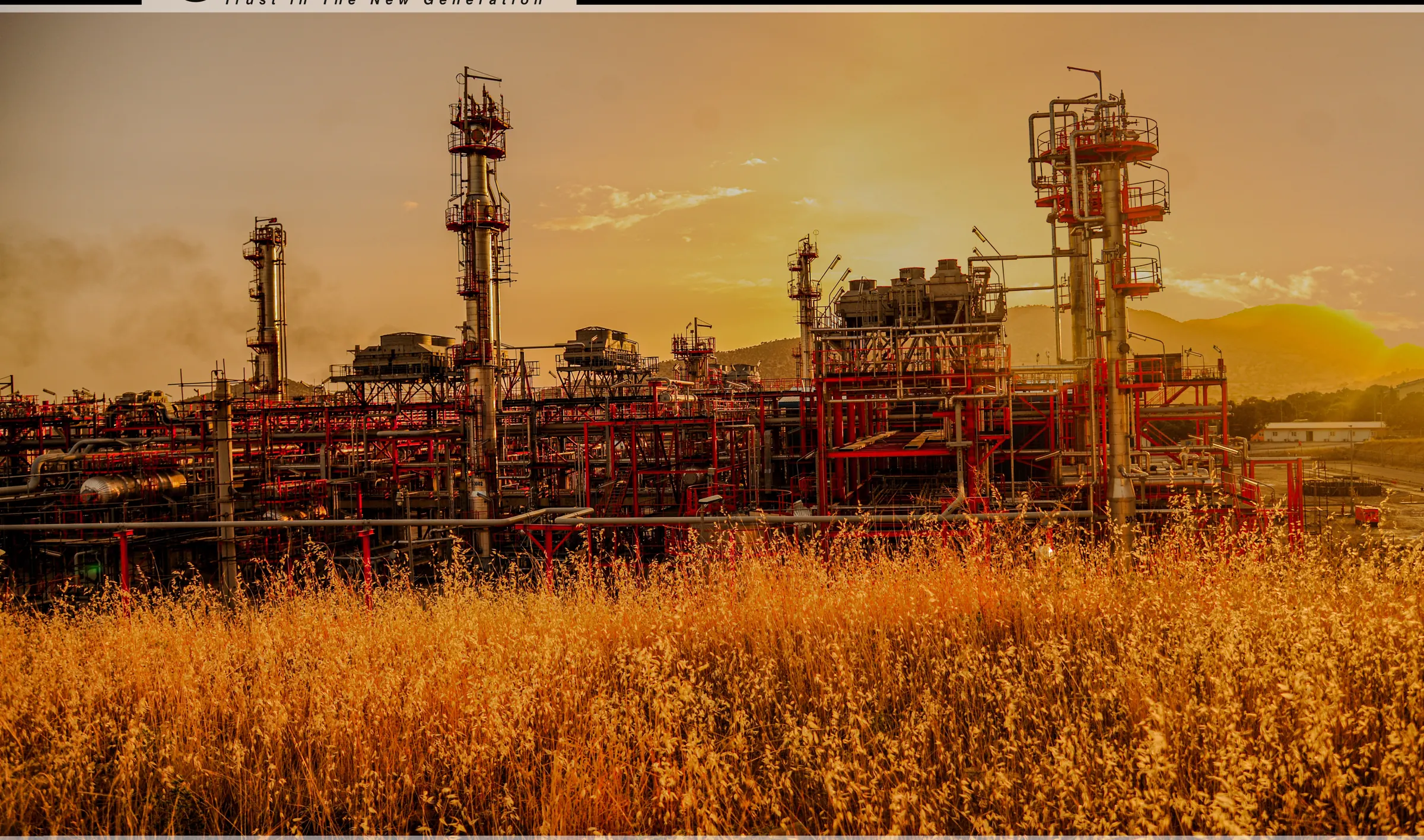 Golden sunset over the Ilam petrochemical complex and wheat fields