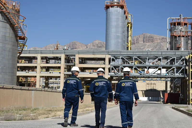 Team beneath the distillation columns